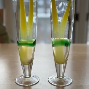 Elegant Glass Champagne Flutes with Yellow and Green Design